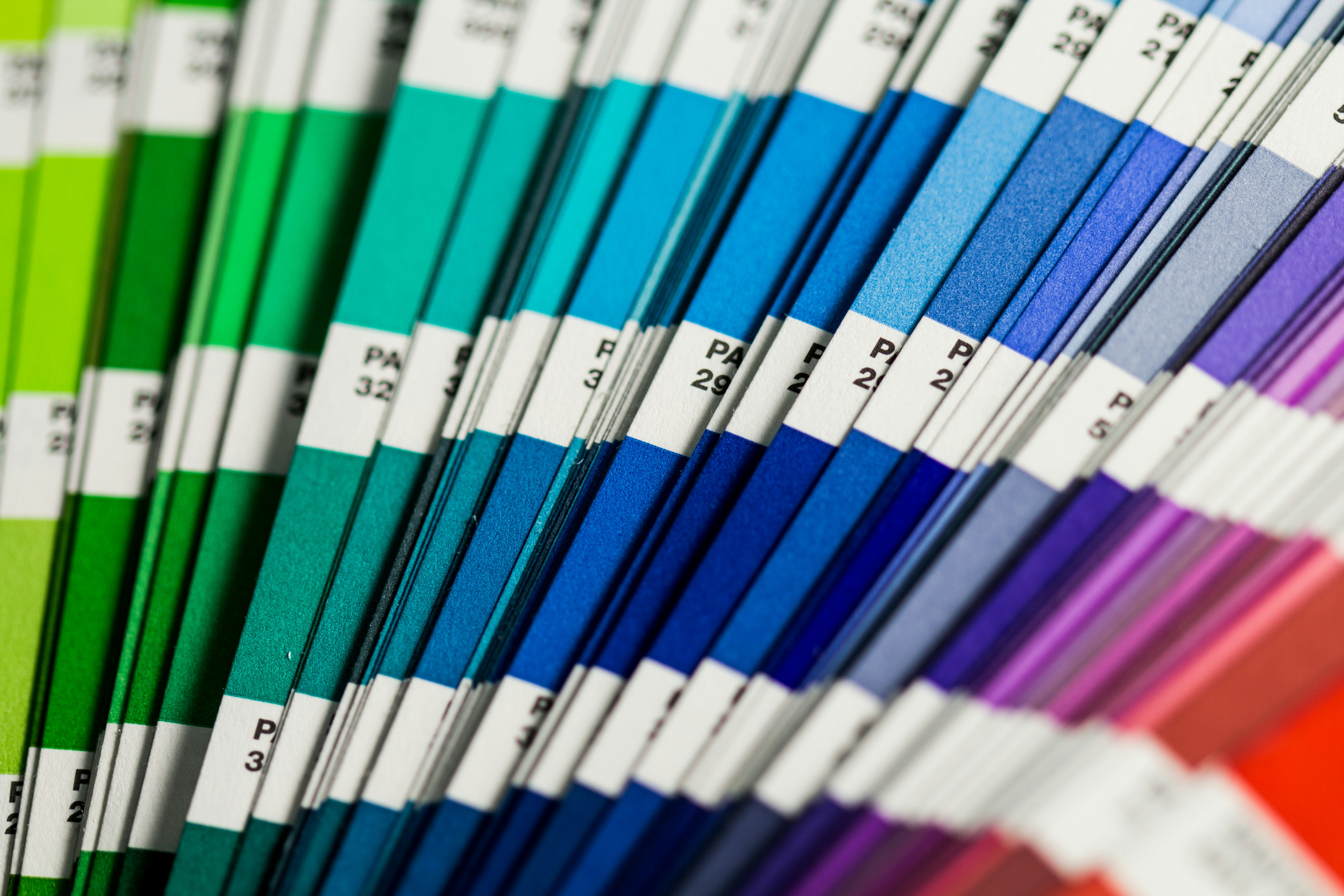 Professional color swatch cards and material samples showing designer creative process organization
