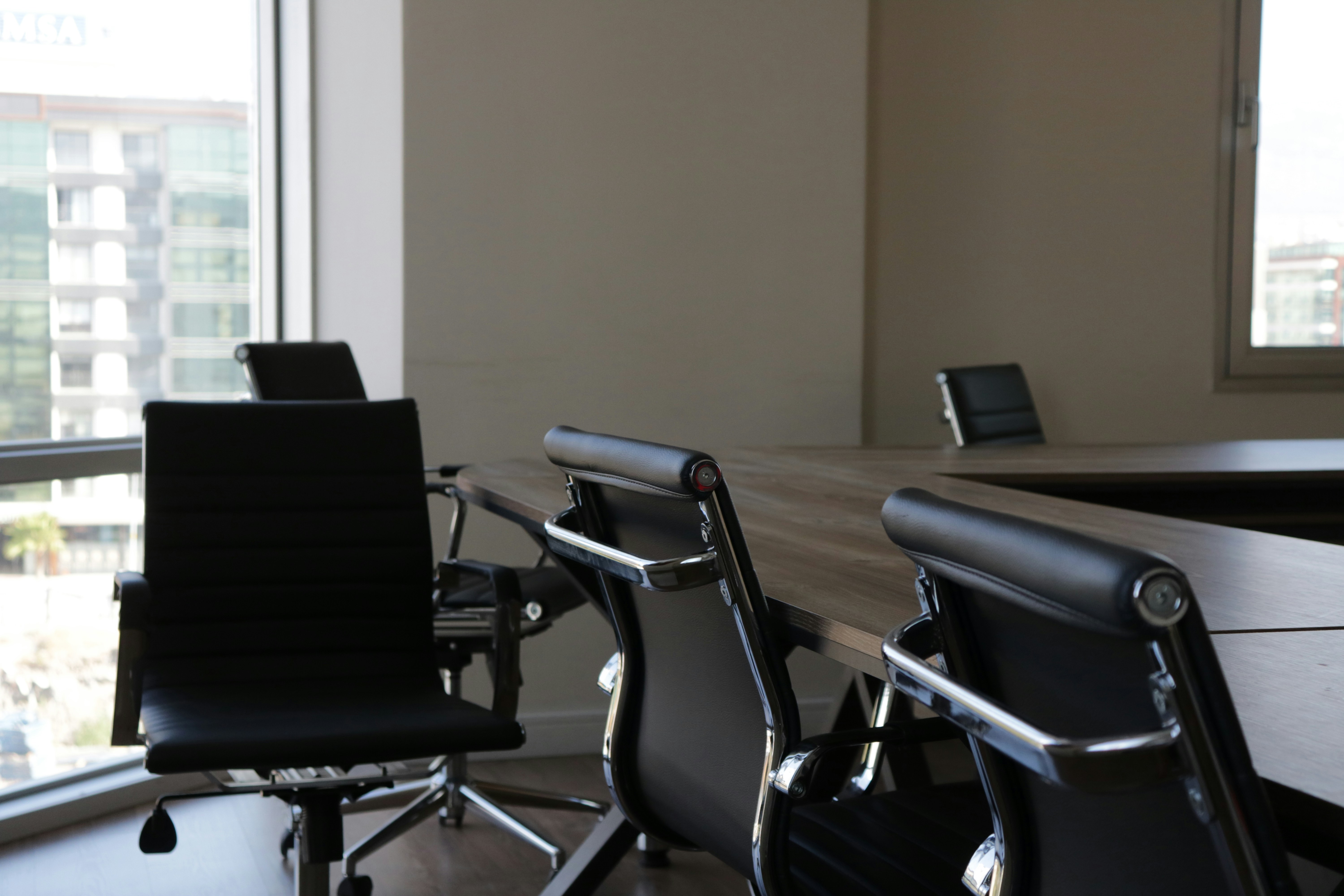 Empty office chairs in conference room